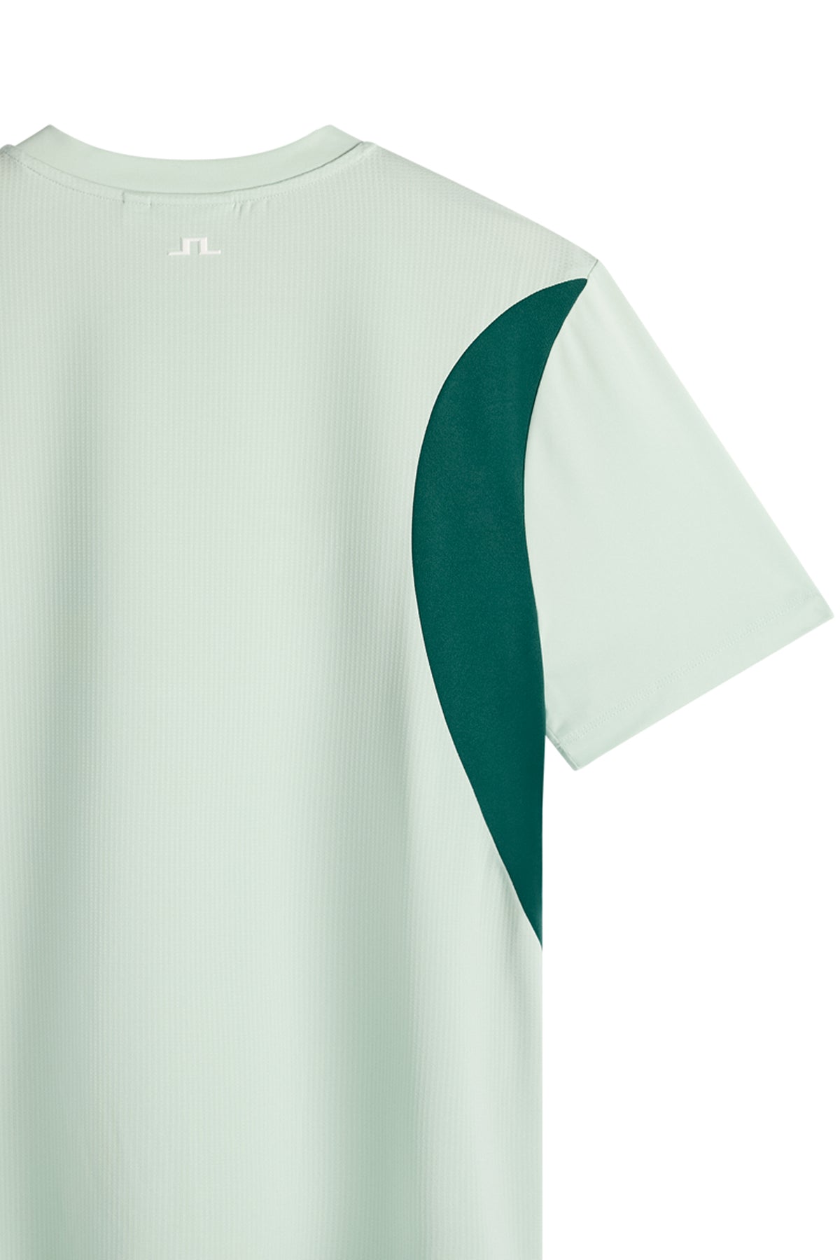 Back detail view: Light green Dennis T-shirt with a dark green side panel and small white Bridge logo below the neck.