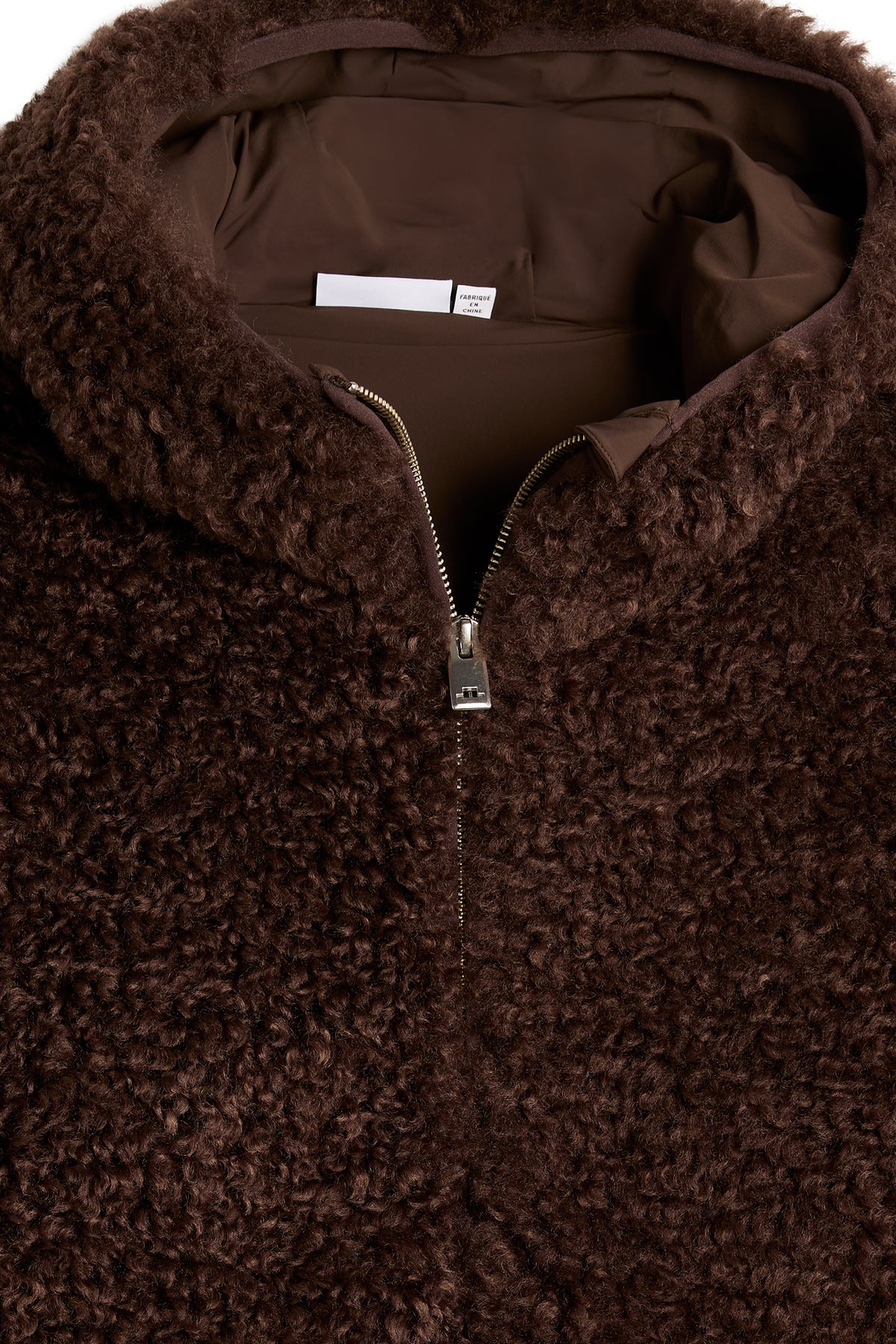 Close-up of the Elina Pile Jacket in Seal Brown, showing the textured pile material, hood, and front zipper.