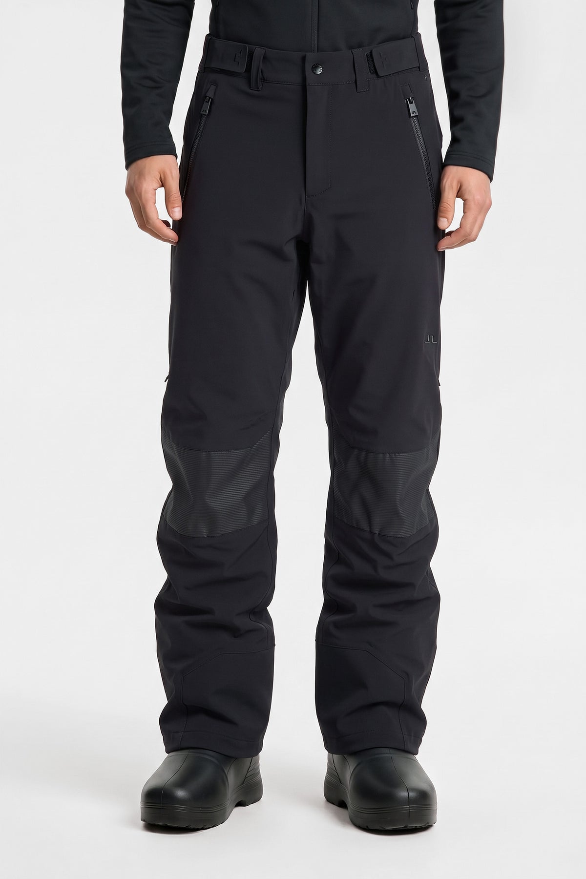 Whitman Pant in black, front view featuring zippered pockets and reinforced knee panels.