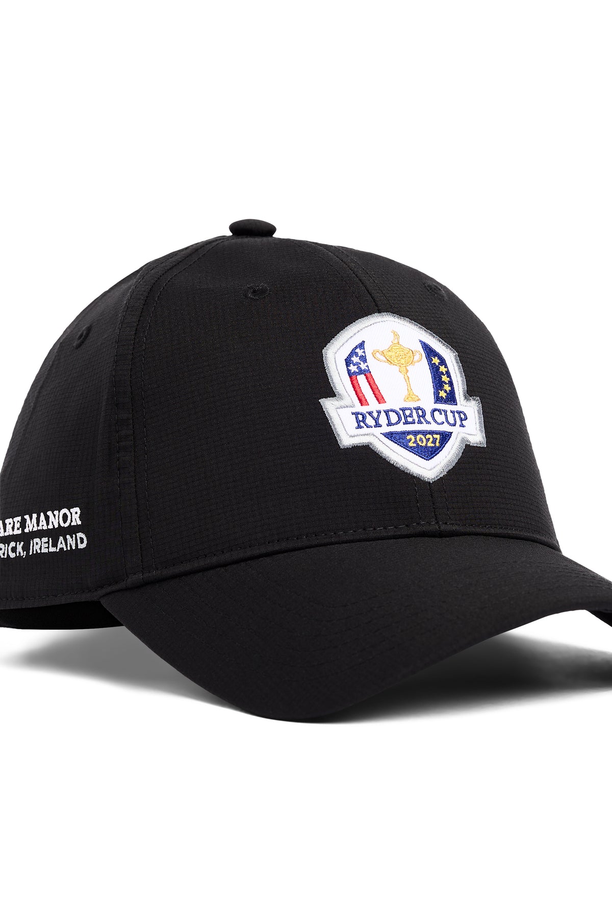 Close-up of black Abe Cap featuring the embroidered 2027 Ryder Cup badge and Adare Manor side text.