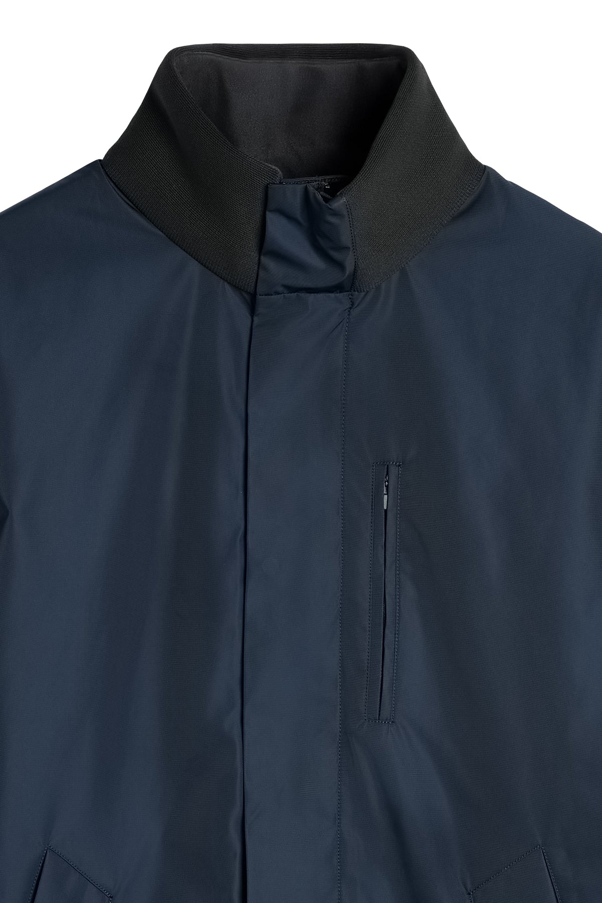 Harold Padded Jacket in JL Navy, close-up view showing the ribbed collar and zippered chest pocket.