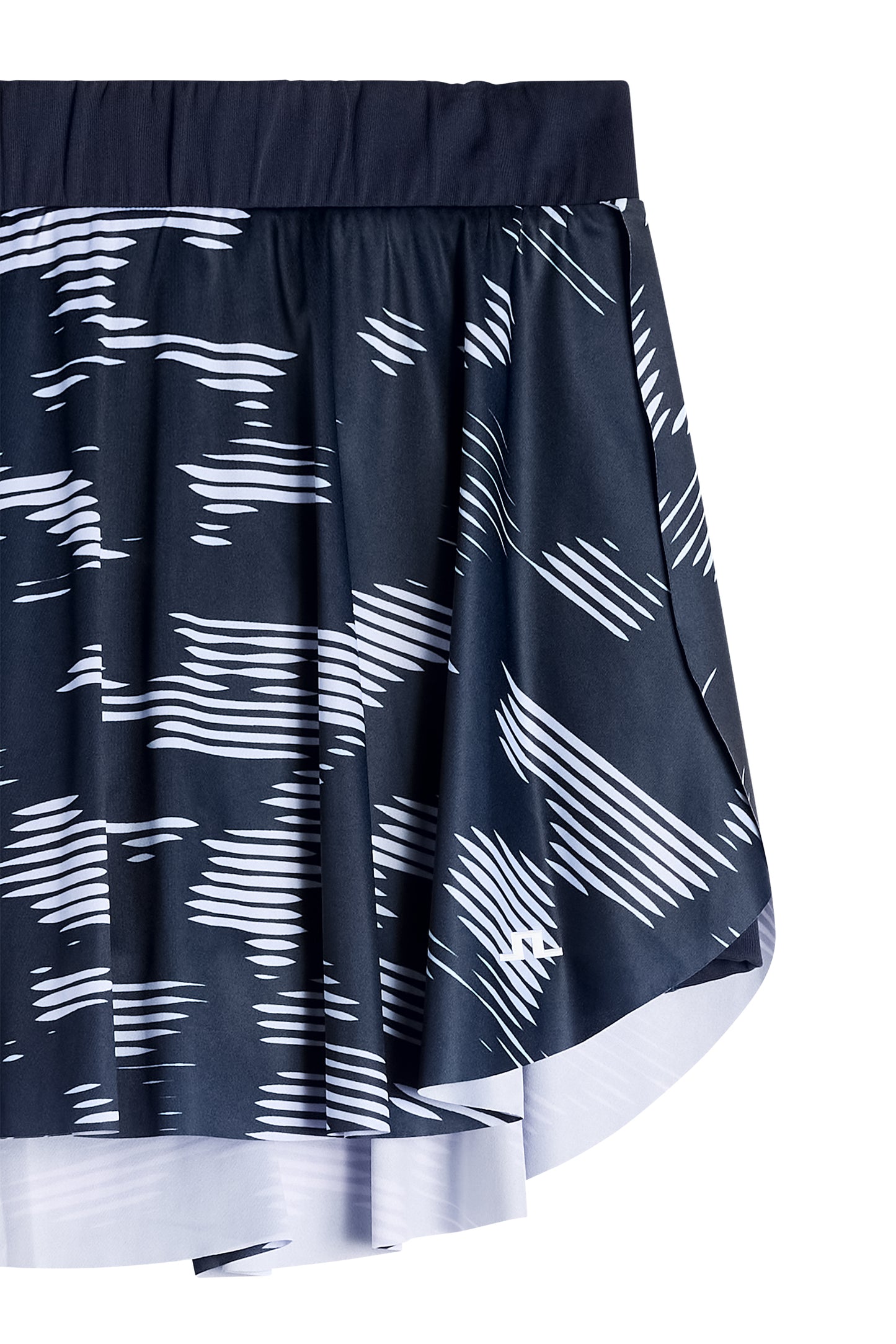 Close-up: Feilia Print Skirt in Clay Purple Heather met grafische print en Bridge-logo op de zoom.