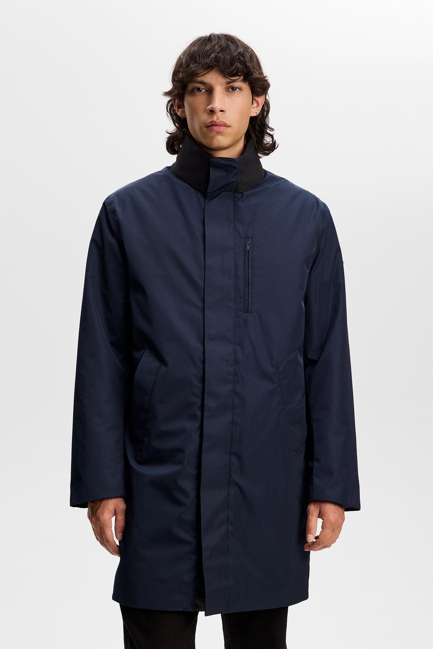 Harold Padded Jacket in JL Navy, front view on model showcasing the ribbed collar, chest pocket, and clean placket.