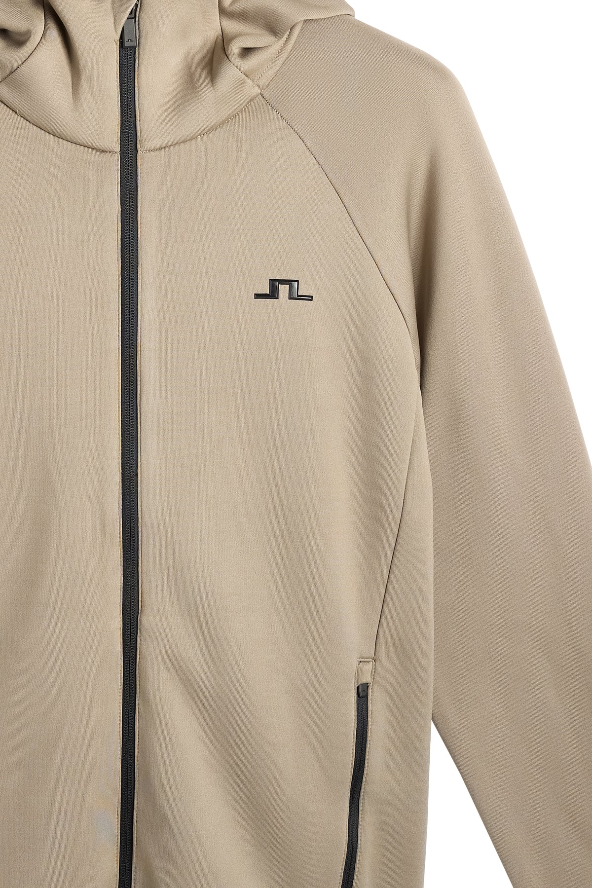 Gros plan : Pollock Polartec Hood en Brindle avec fermeture zippée et logo Bridge noir sur la poitrine.