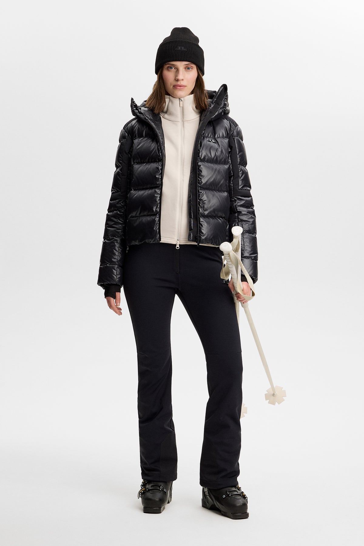 Model wearing the Portia Polartec Hood in Moonbeam layered under a black ski jacket.