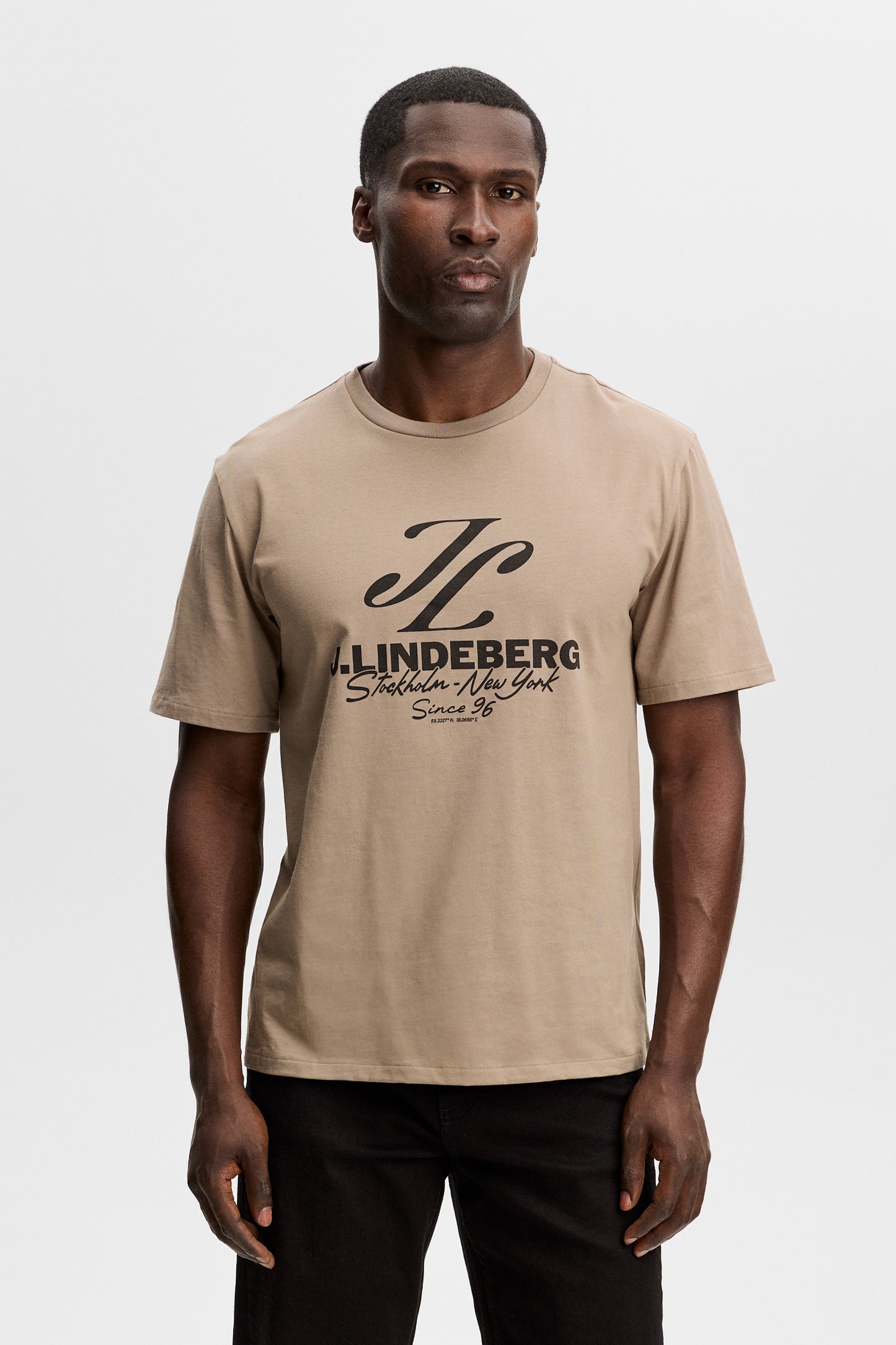 Model wearing the Alpha Graphic T-shirt in brindle, front view showing the bold J.Lindeberg chest graphic.