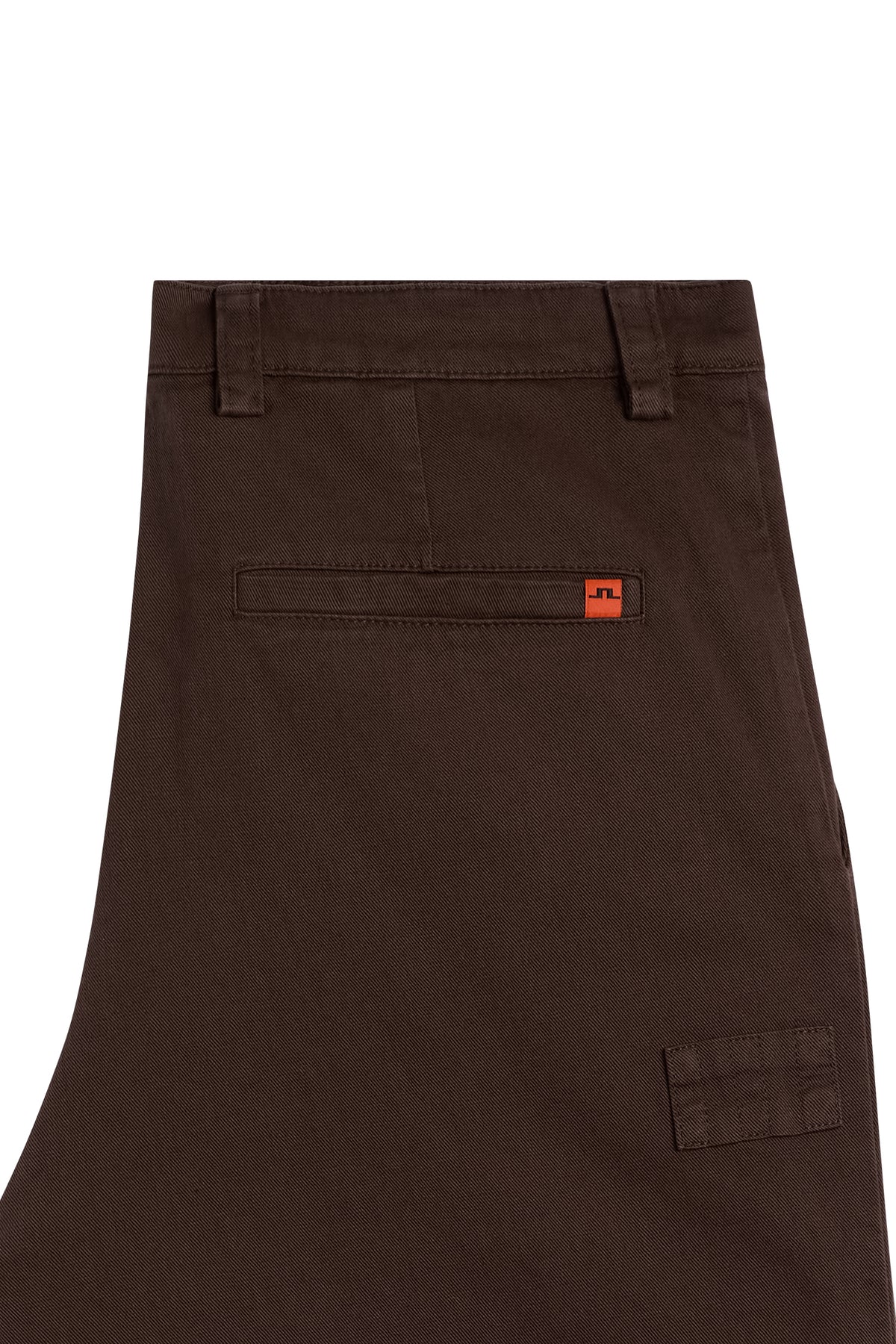 Close-up: Devyn Straight Cotton Pants in Seal Brown showing the back welt pocket and orange Bridge logo tab.