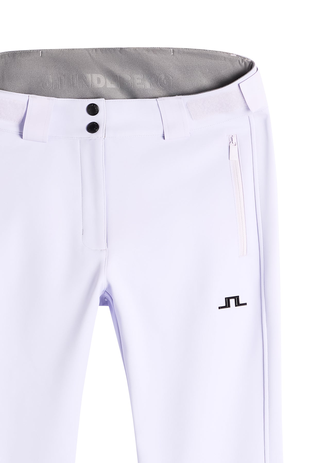 Nærbillede: Stanford Softshell Ski Pant i Purple Heather med knaplukning, lynlåslomme og sort Bridge-logo på benet.