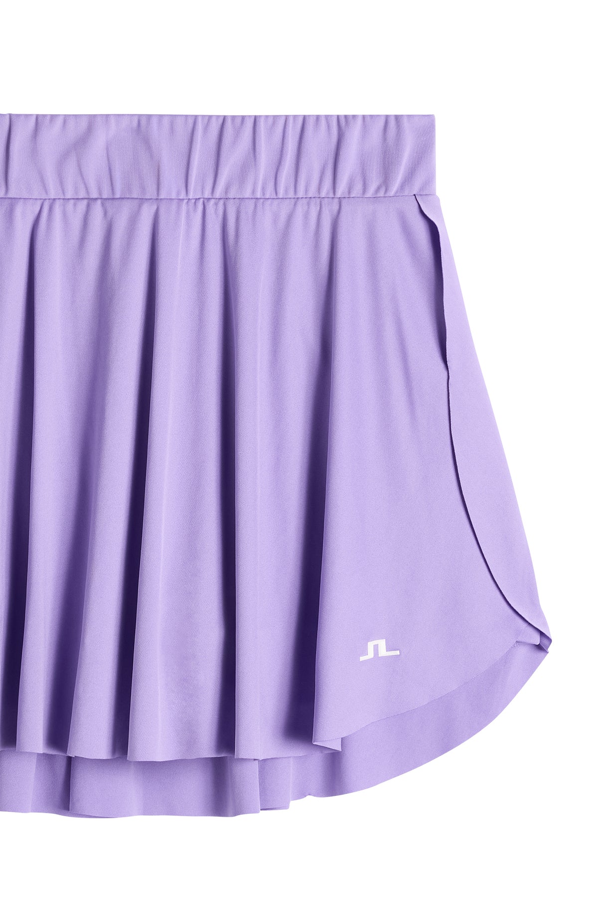 Gros plan : Feilia Skirt en Paisley Purple avec taille élastique, matière fluide et logo Bridge blanc sur l'ourlet.