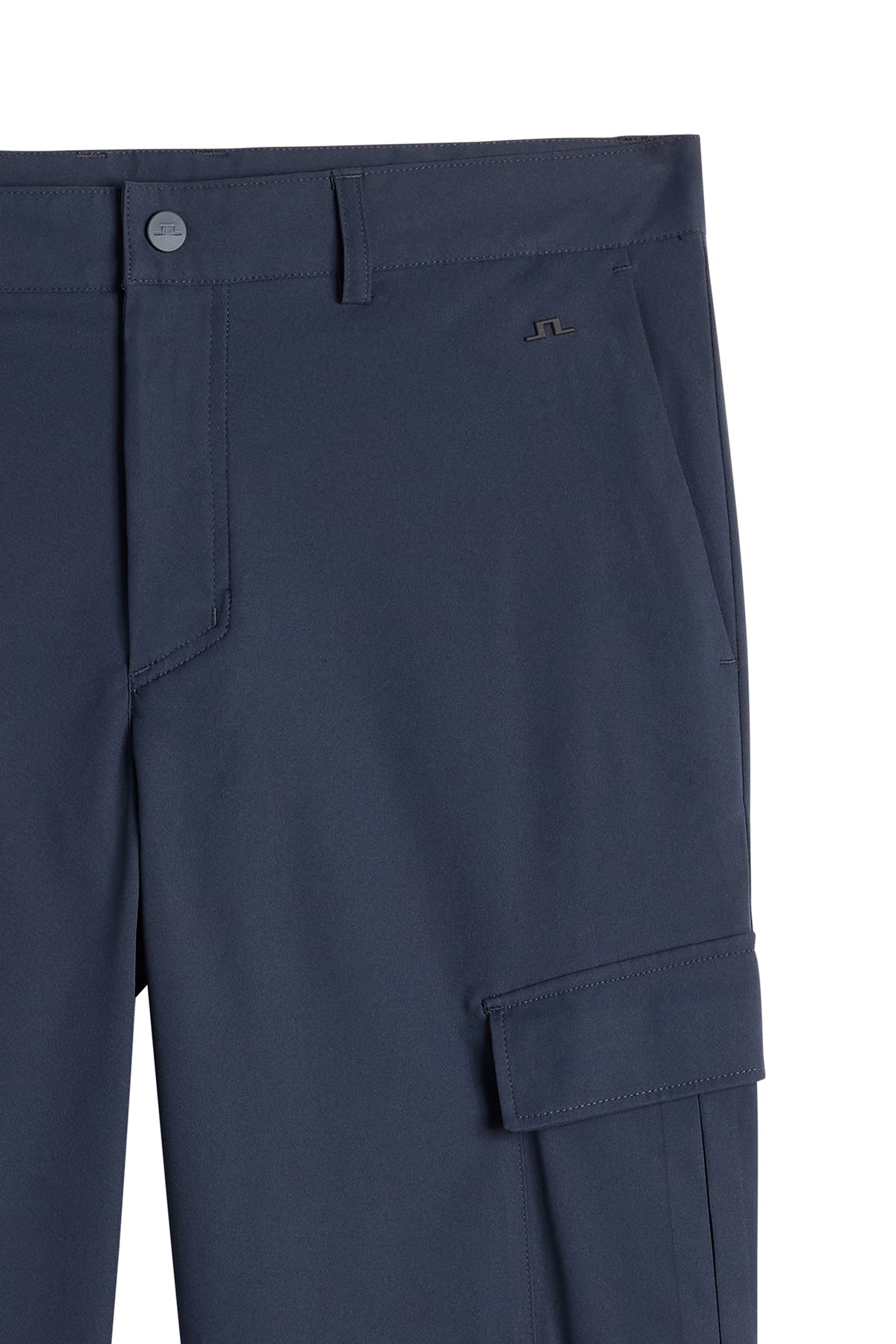 Close-up of the Logan Cargo pant in JL Navy, showing the waistband, small Bridge logo, and side cargo pocket.