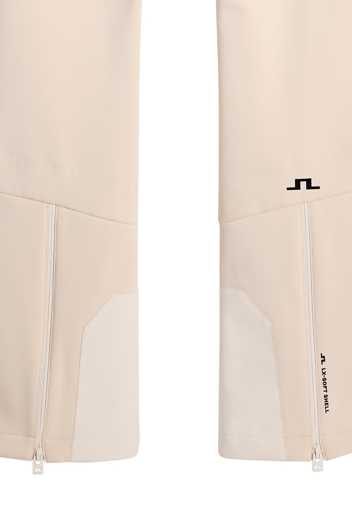 Close-up: Aviana Softshell Bib Pant in Moonbeam met ritsen aan de zoom, versterkte inzetten en het Bridge-logo.