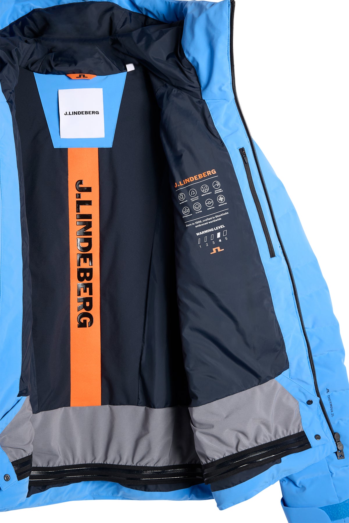 Inside view of the Thornton Down Jacket in Sonic Blue, showing the lining, inner pocket, and snow skirt.