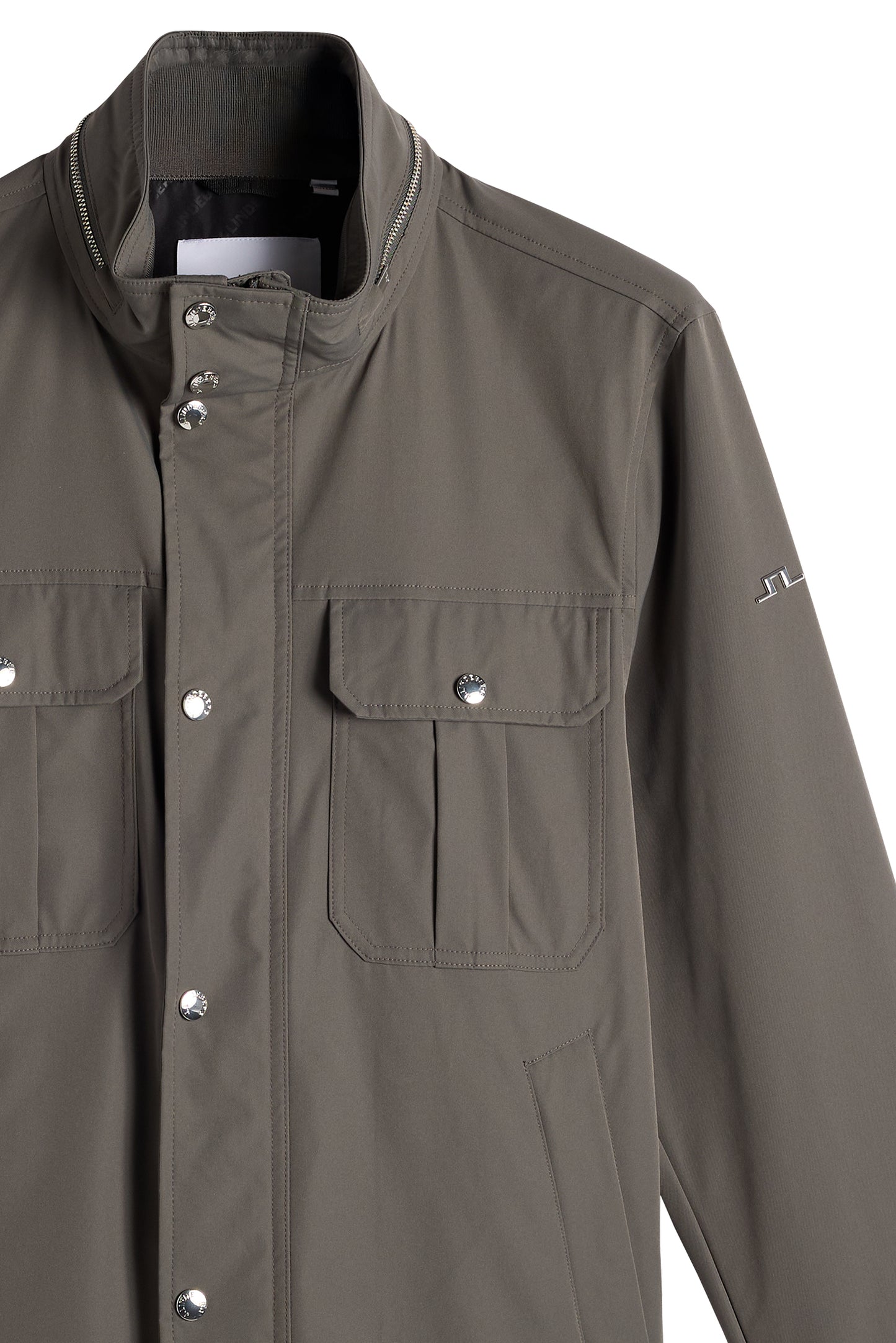 Close-up of the Bailey Recy Poly Jacket in Chimera green, showing chest pockets, snap placket, and sleeve Bridge logo.