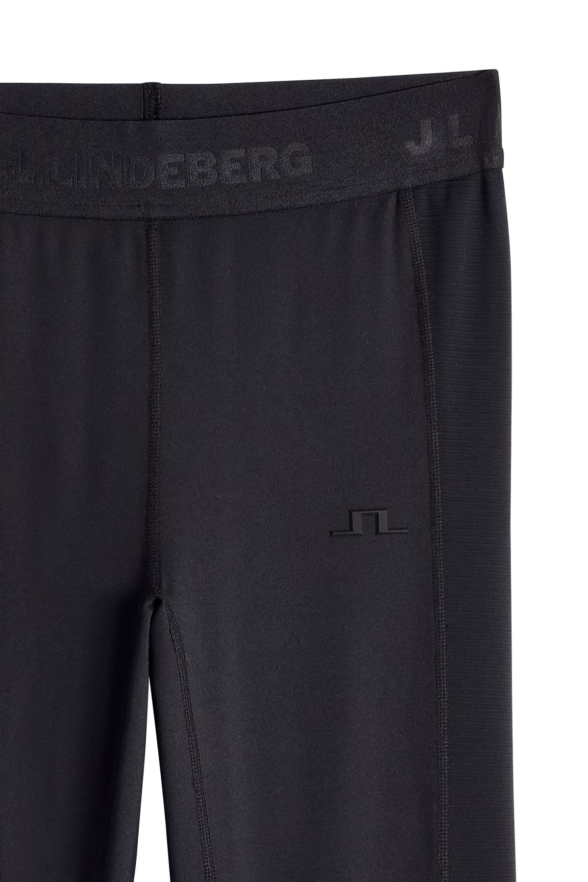 Close-up of the branded elastic waistband and tonal Bridge logo on the Zenit Baselayer Pant in JL Navy.