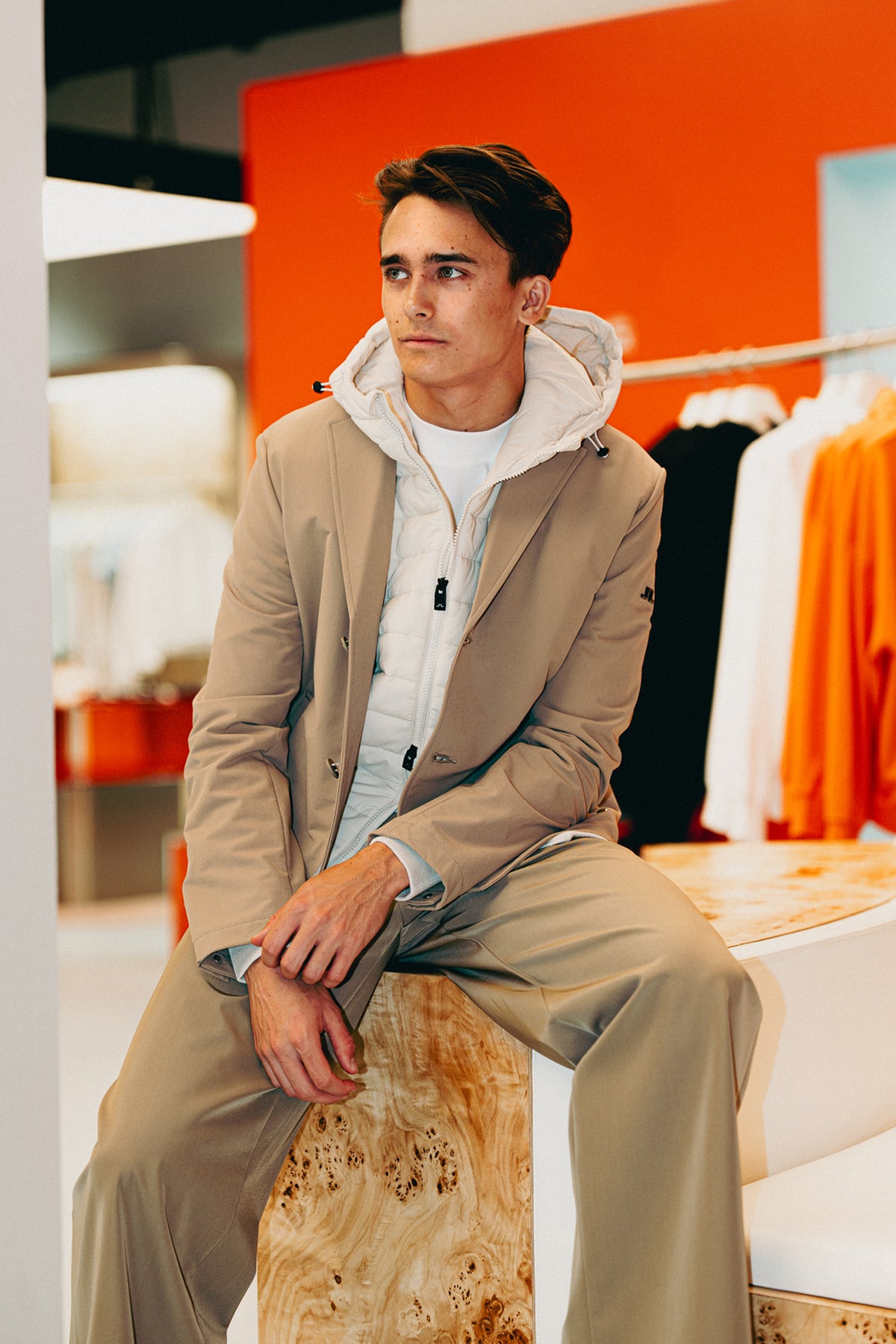 Dino Beganovic wearing J.Lindeberg The Beige Look with tonal performance layers