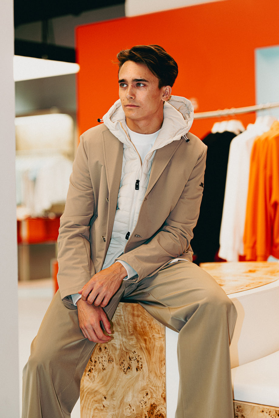 Dino Beganovic wearing J.Lindeberg The Beige Look with tonal performance layers