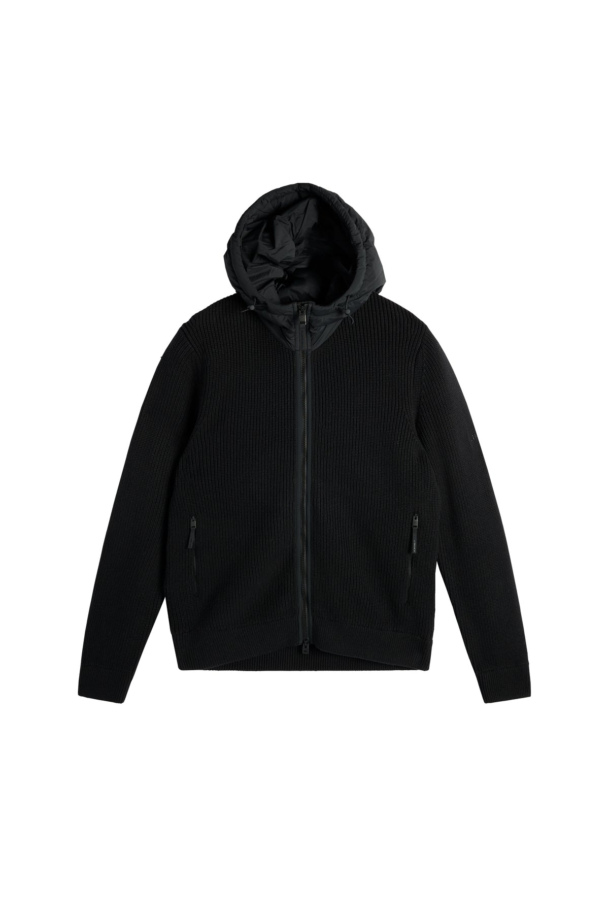 Framifrån: Dorin Knit Hood Hybrid Jacket i svart med stickad struktur, vävd huva och tvåvägsdragkedja fram.