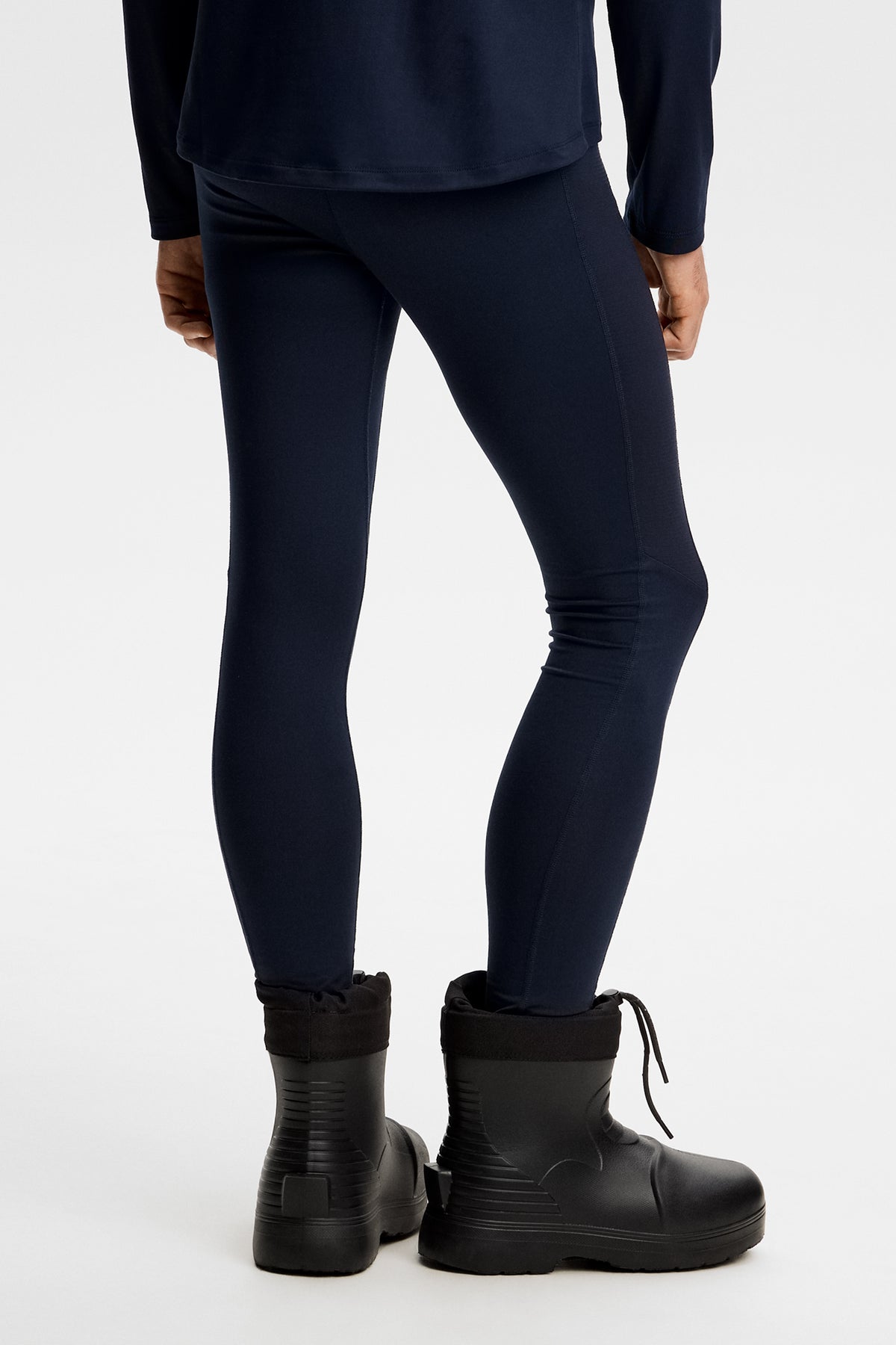 Back view: Zenit Baselayer Pant in JL Navy, highlighting the slim fit and flatlock seams.