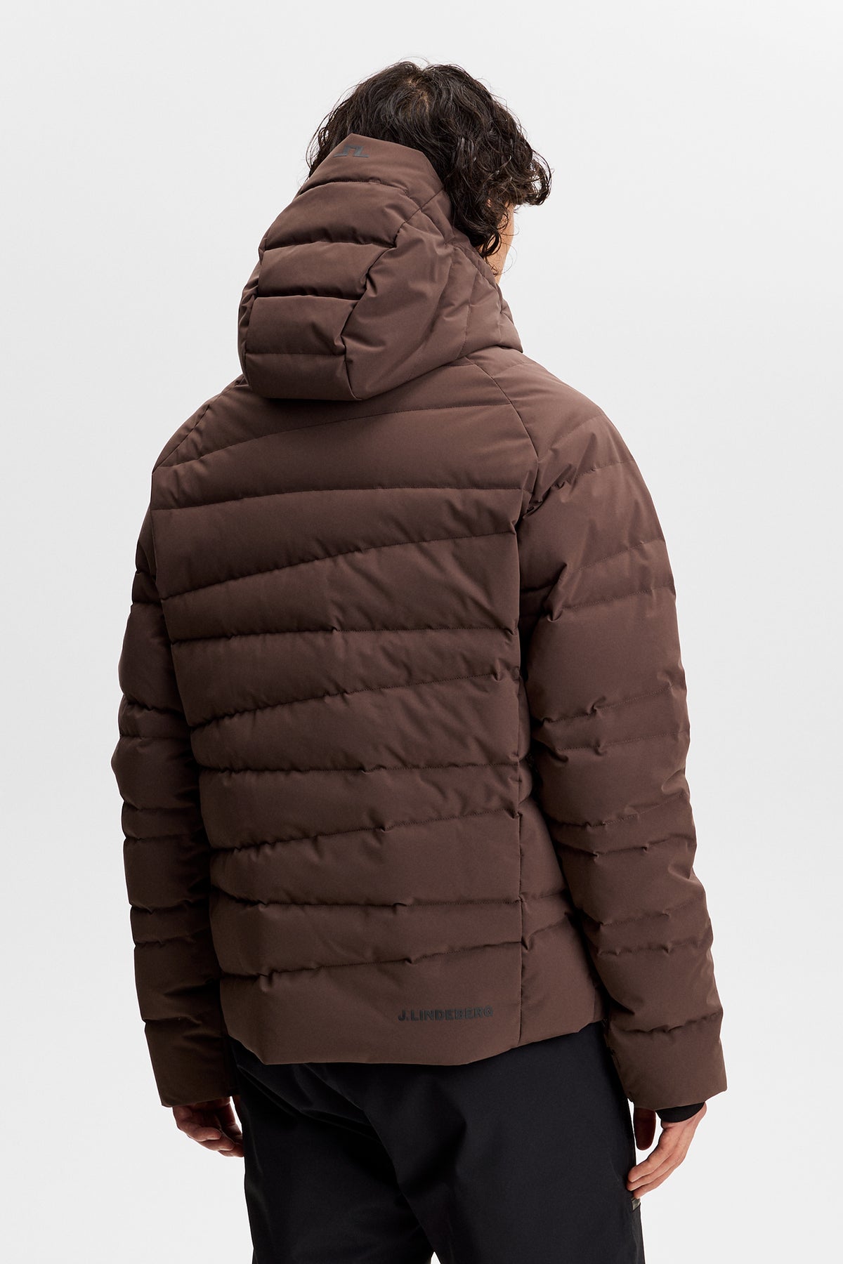 Thornton Down Jacket in Seal Brown, back view showing horizontal quilting and hood with Bridge logo.