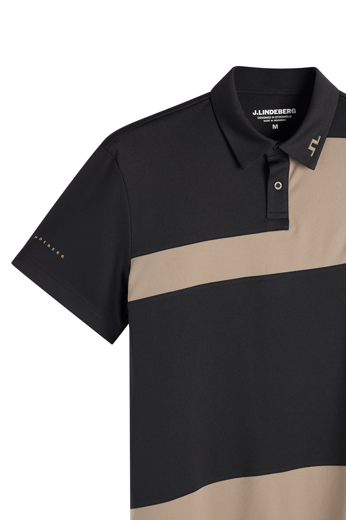 Close-up: Black Sidd Polo featuring beige contrast panels, a button placket, and a Bridge logo on the collar.