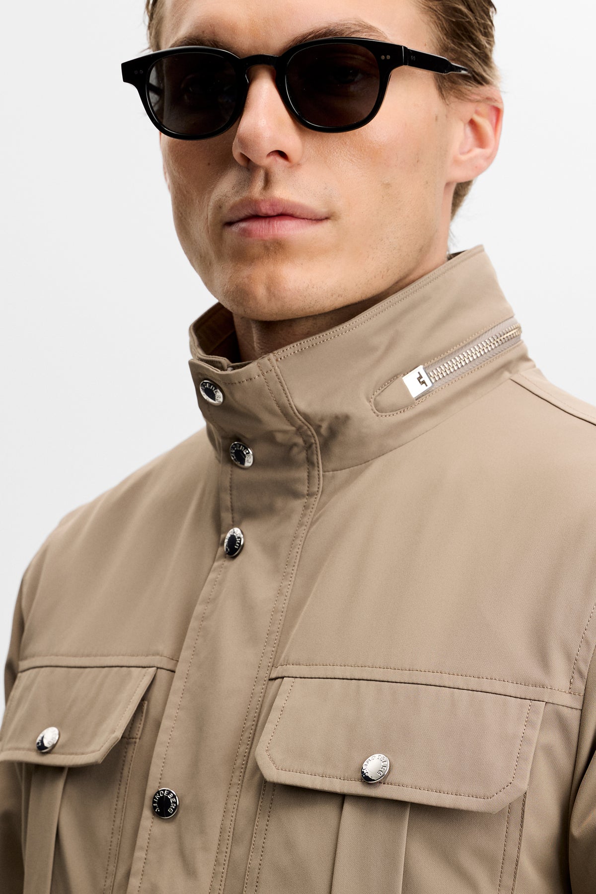 Close-up view: Bailey Recy Poly Jacket in Brindle, featuring the zipped collar and snap chest pockets.