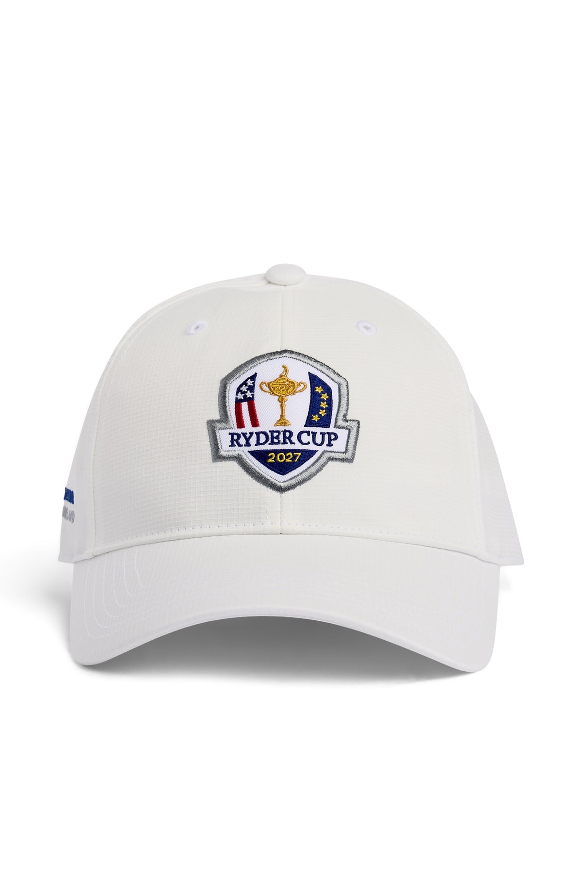 Abe Cap in white, front view with embroidered 2027 Ryder Cup shield badge and curved visor.