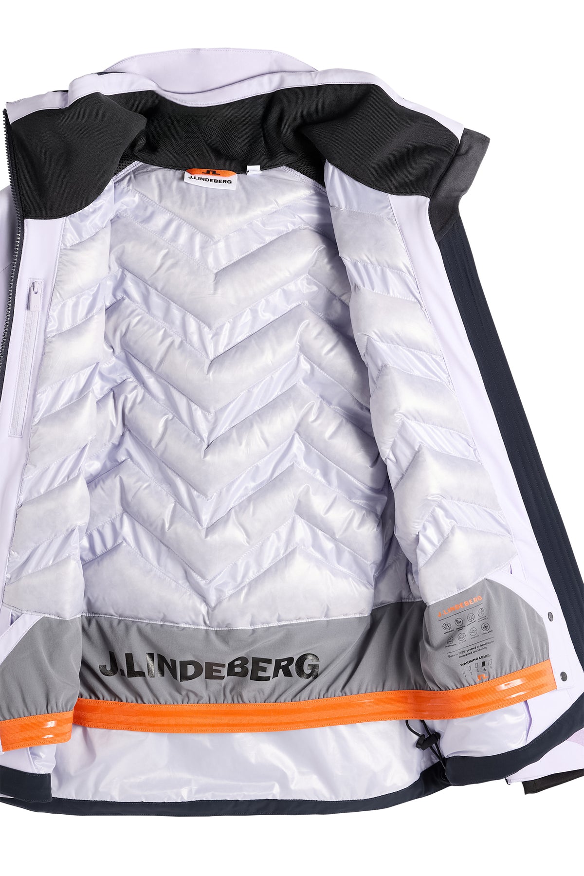 Detailansicht: Gestepptes Innenfutter und integrierter Schneefang der Soleil Down Jacket in Purple Heather.