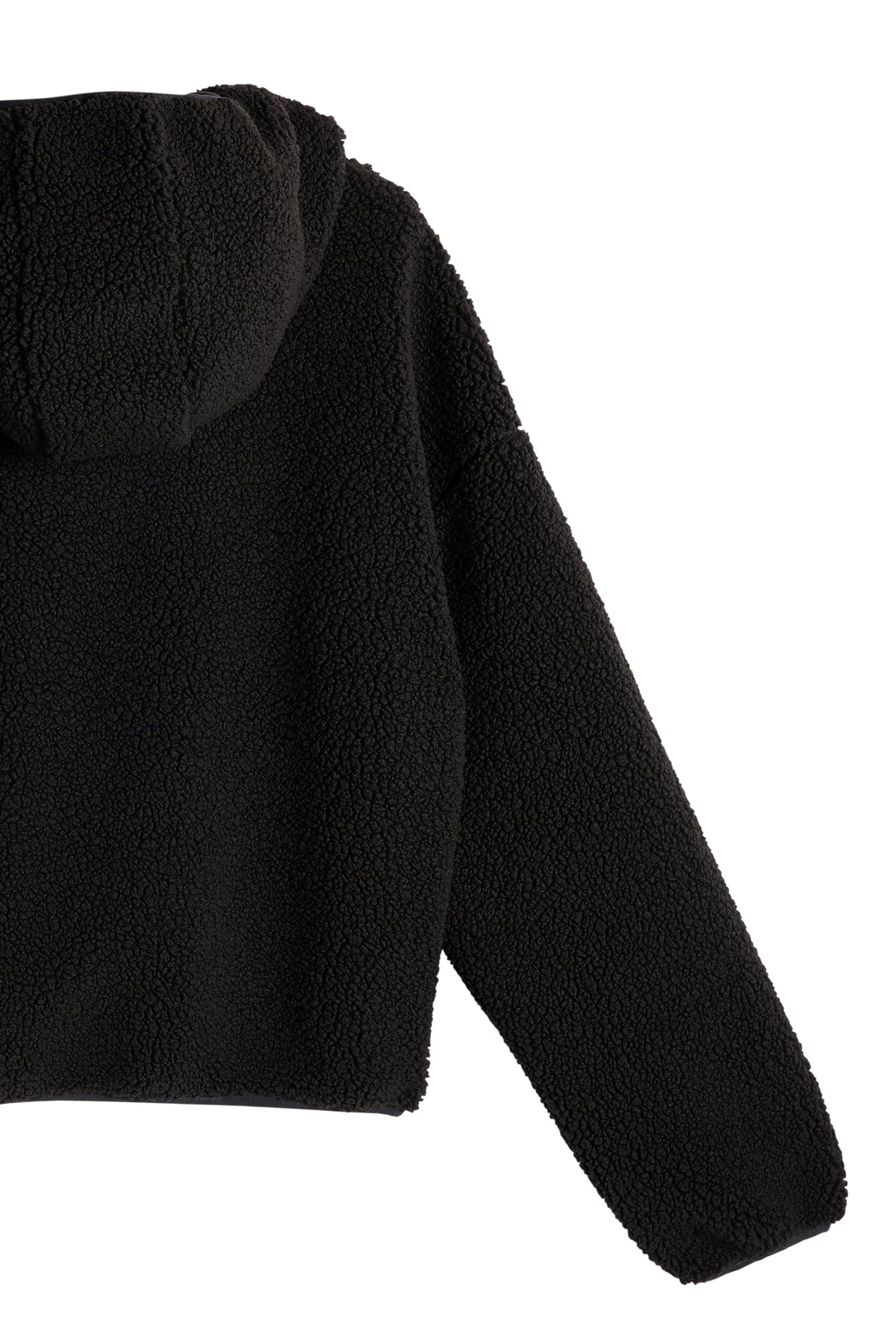 Detailansicht: Schwarzer Comona Pile Hood aus weichem Teddy-Fleece mit Kapuze und elastischem Saum.