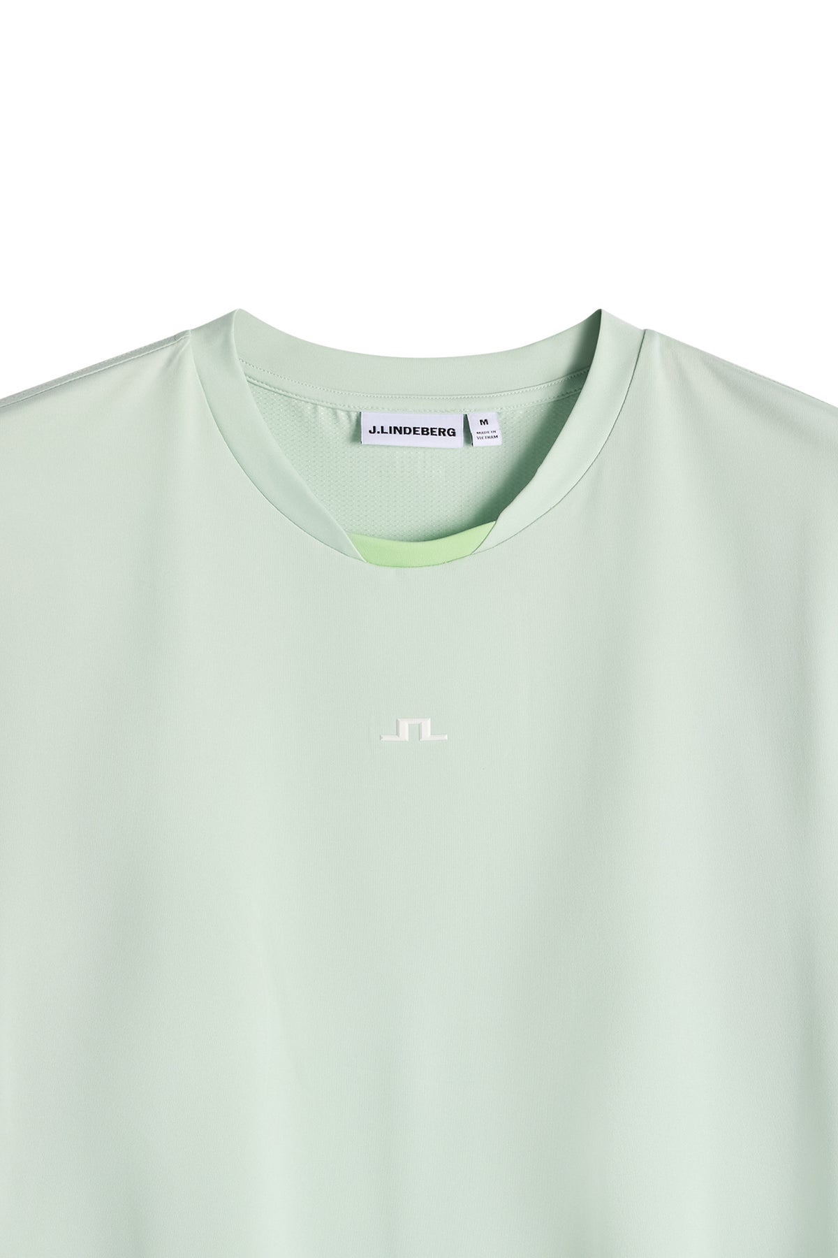 Close-up of the Dennis T-shirt in light green, featuring a crew neck and a small white Bridge logo.
