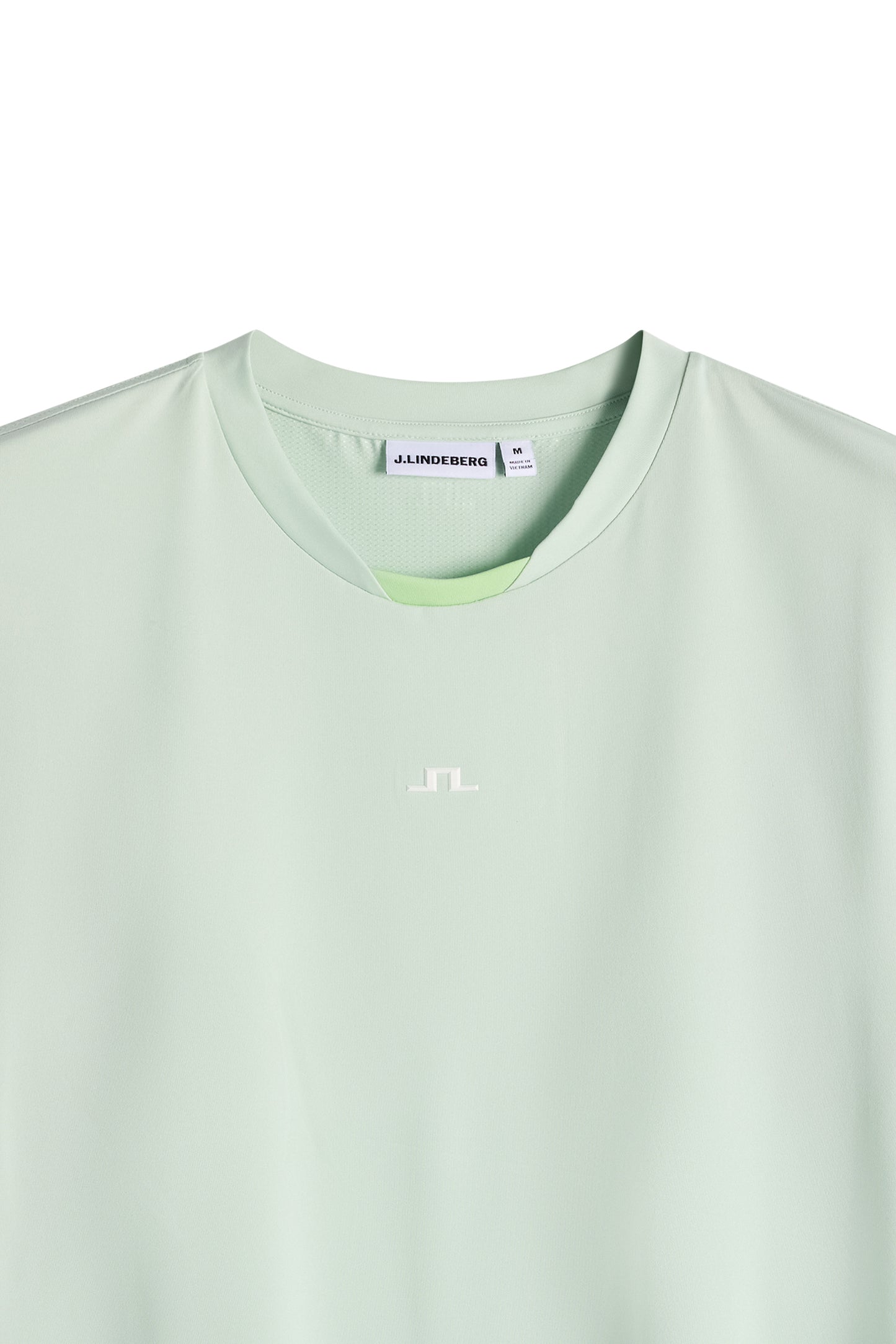 Close-up of the Dennis T-shirt in light green, featuring a crew neck and a small white Bridge logo.