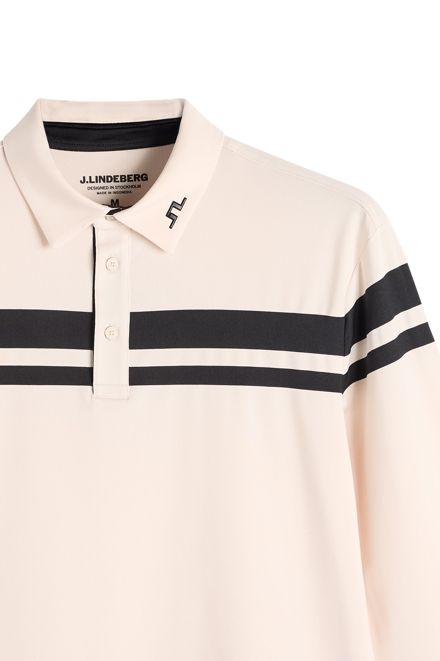 Close-up of the Kenny LS stripe polo in cream with black stripes, button placket, and Bridge logo on the collar.