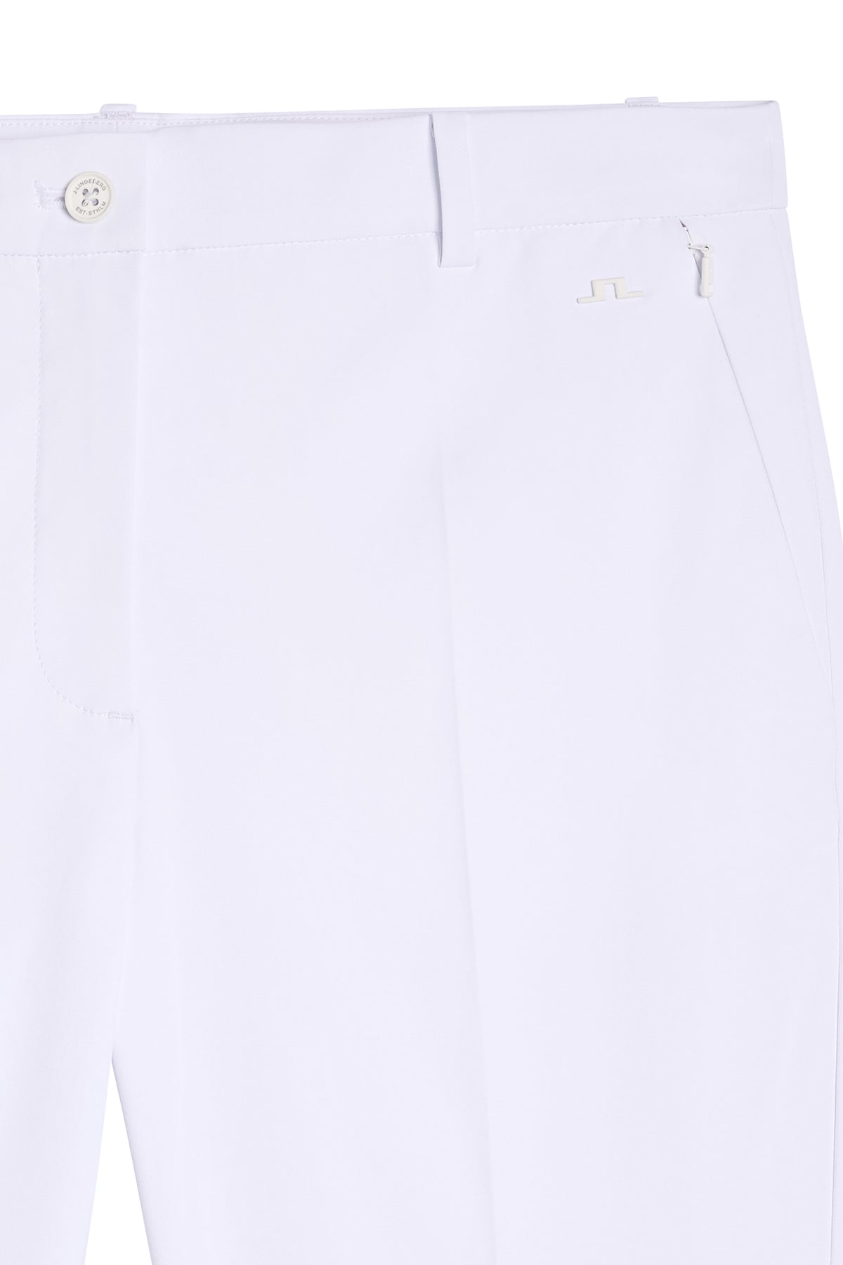 Close-up of the white Pia Pant with button closure, zip pocket, and tonal Bridge logo.